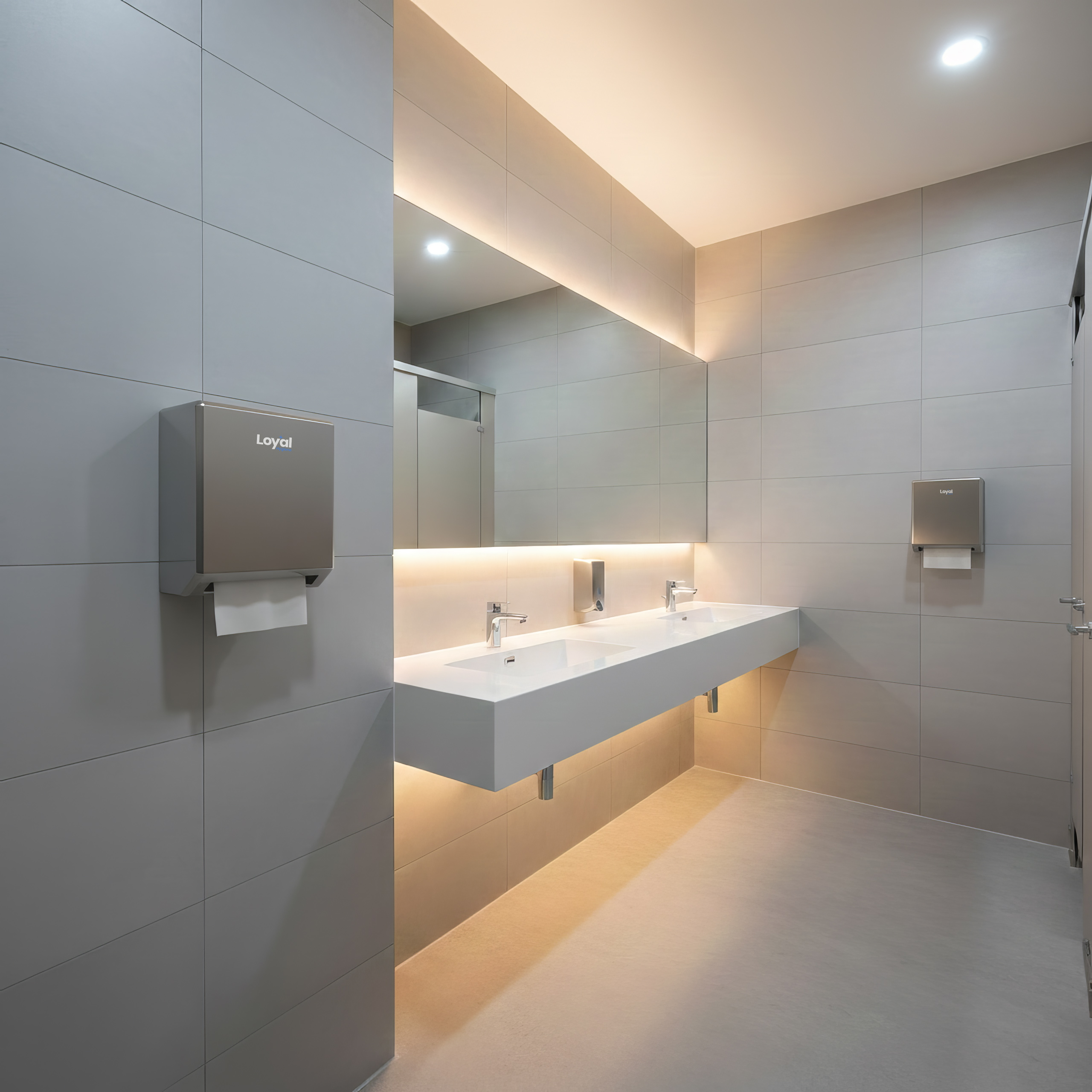 Modern commercial restroom with Loyal-branded dispensers